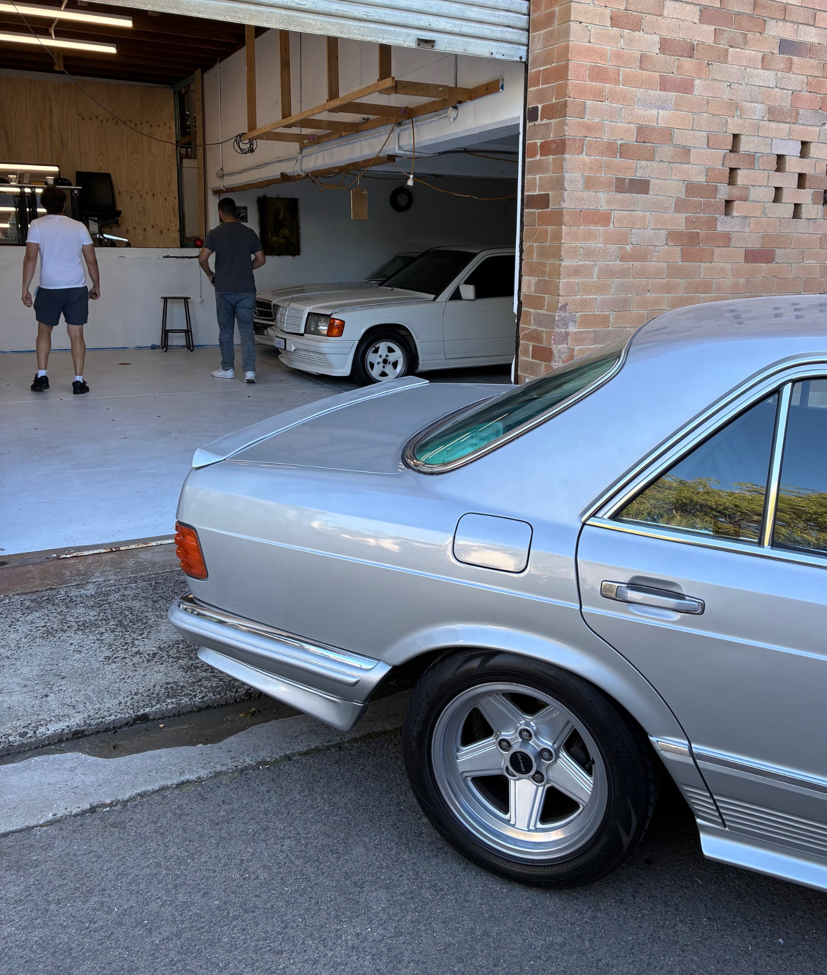Classic Mercedes cars in an enthusiast garage